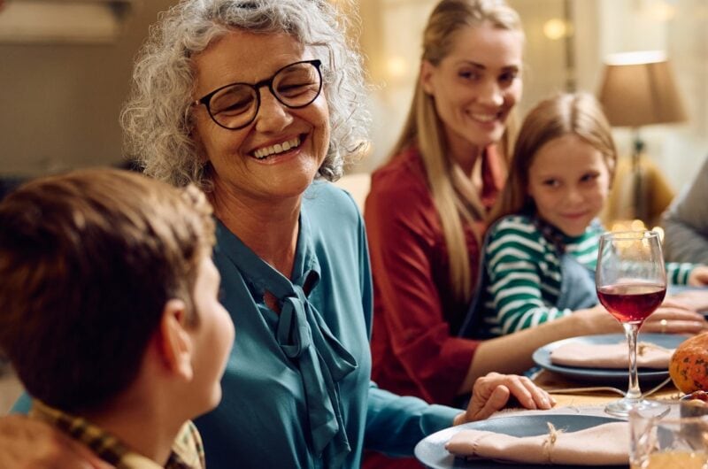 Family of older adult woman, children and their mother and father